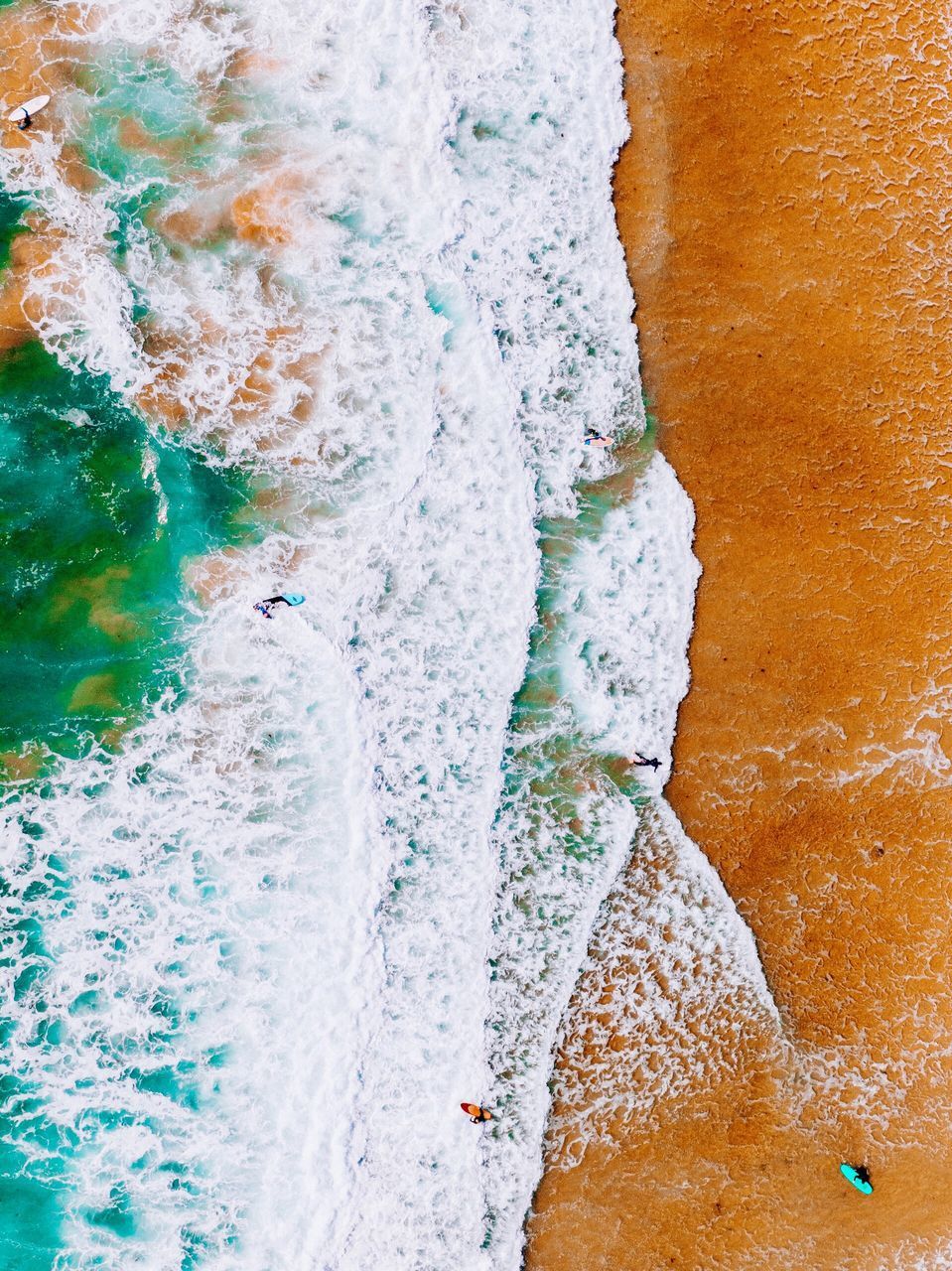 CLOSE-UP OF WATER SPLASHING ON ROCKS