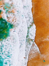 High angle view of water splashing on rocks