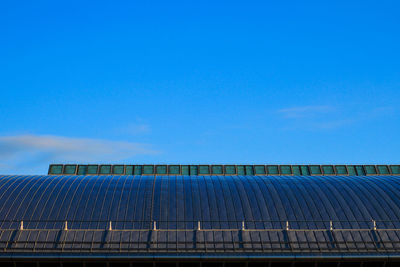 Scenic view of blue sky seen through metallic structure