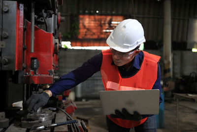 Midsection of man working at construction site