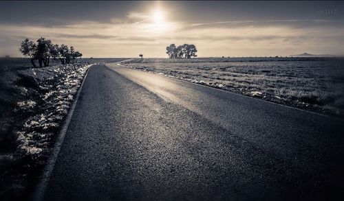 Empty road at sunset