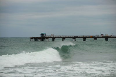 Pier over sea against sky