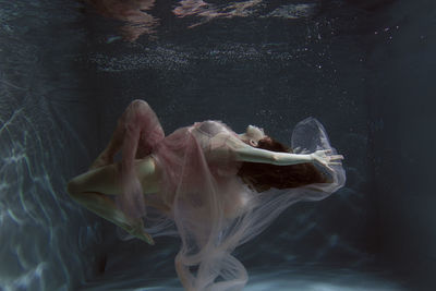 Woman swimming in pool