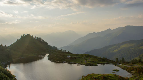 Panoramic view of lake against sky during sunset