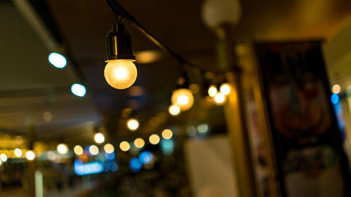 Close-up of illuminated light bulb decorations at home