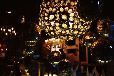 Illuminated lanterns hanging at night