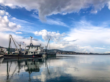 Boats moored at harbor