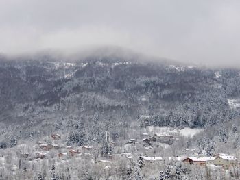 High angle view of snowcapped mountains against sky