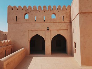 Entrance of historic building against sky