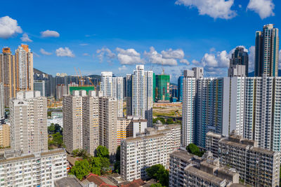 Modern buildings in city against sky