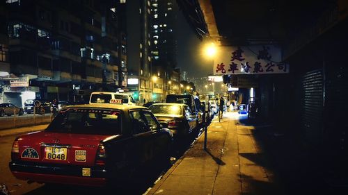 Illuminated city street at night