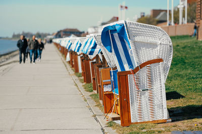 Wicker beach chair in a row at the sea