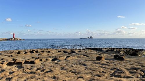 Scenic view of beach against sky