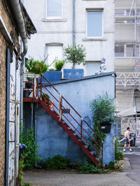 Staircase by building in city