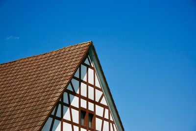 Low angle view of building against clear blue sky