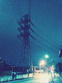 Power lines against blue sky