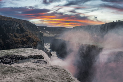 Beautiful gullfoss waterfall in golden circle against cloudy sky during sunset