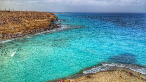 Scenic view of sea against blue sky