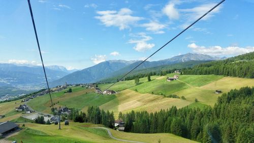 Scenic view of landscape against cloudy sky