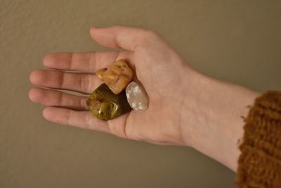 Cropped hand of woman holding pills