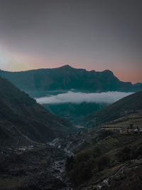 Scenic view of mountains against sky during sunset