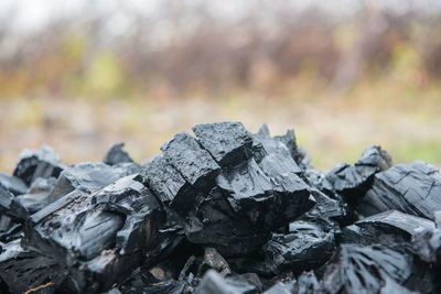 Close-up of stack of charcoal from woody biomass