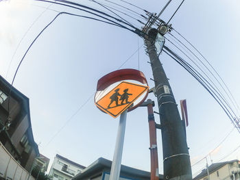 Low angle view of power lines against clear sky