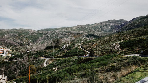 Scenic view of landscape and mountains against sky