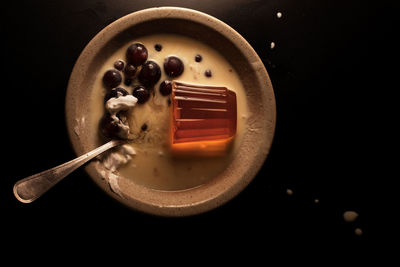 Directly above shot of breakfast on table against black background