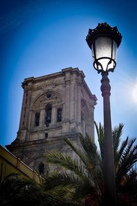 Street light against clear blue sky