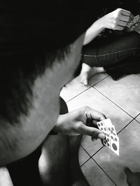 High angle view of man playing piano at home