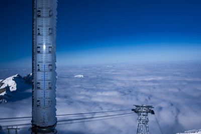 Communications tower against clear blue sky
