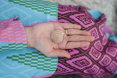 High angle view of woman holding fabric