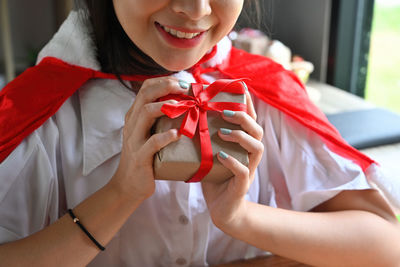 Close-up of woman holding gift