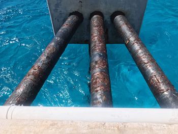 High angle view of rusty pipe in swimming pool