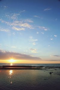 Scenic view of sea at sunset