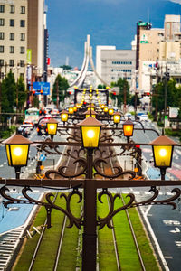 Street lights against buildings in city