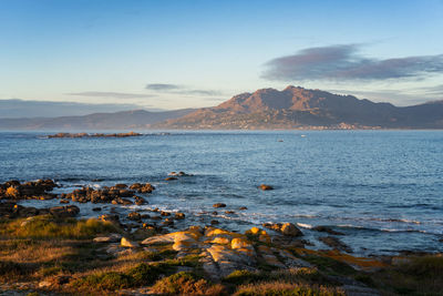 Caldebarcos panorama view of landscape with mountains at sunset with atlantic ocean in galícia