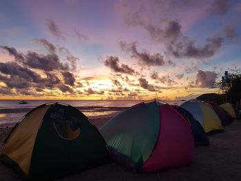 Scenic view of beach against sky during sunrise