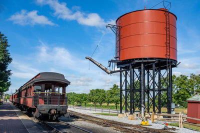 Train on railroad track against sky