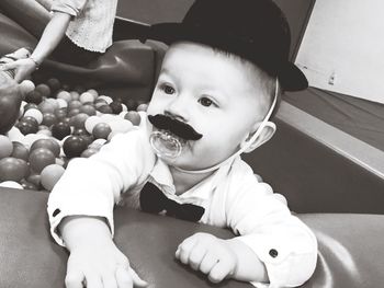 Close-up of cute boy playing in ball pool