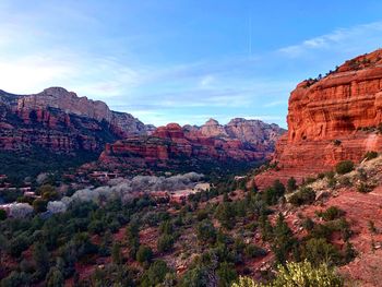 Rock formations on landscape against sky