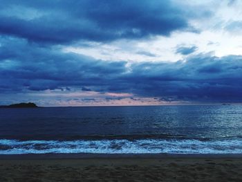 Scenic view of sea against dramatic sky