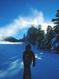 Rear view of a man in snow