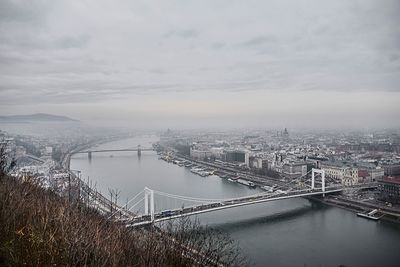High angle view of bridge over river against cloudy sky