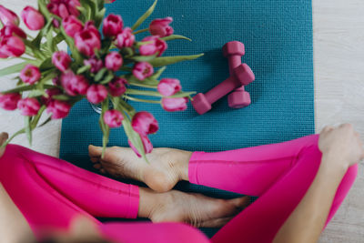 Low section of woman holding gift