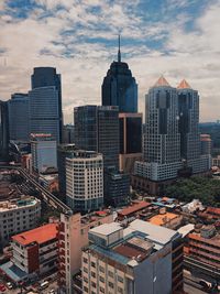 Modern buildings in city against sky