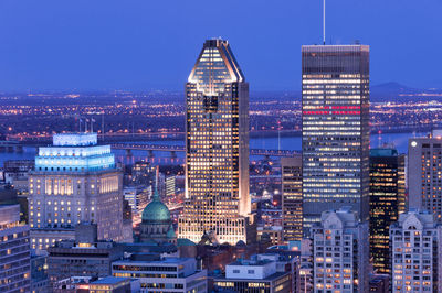 Illuminated buildings in city at night