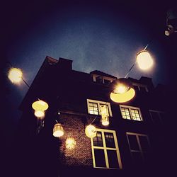 Low angle view of illuminated street light at night