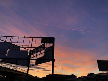 Low angle view of silhouette building against sky during sunset